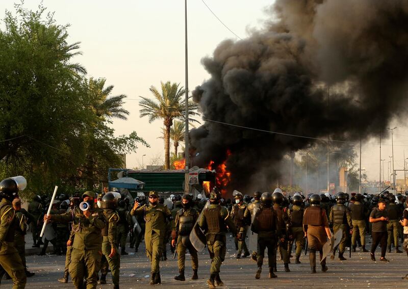 Thousands of protesters clashed with security forces in Baghdad's Tahrir Square. AP