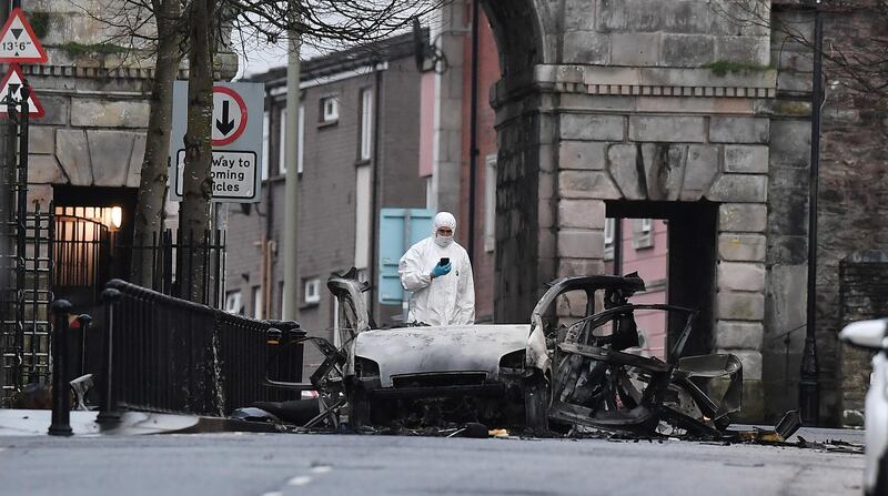 LONDONDERRY, NORTHERN IRELAND - JANUARY 20: A forensic officer inspects the remains of the van used as a car bomb on an attack outside Derry Court House on January 20, 2019 in Londonderry, Northern Ireland. Dissident republicans are suspected to have carried out the attack which has been condemned by Northern Ireland politicians. (Photo by Charles McQuillan/Getty Images) ***BESTPIX***