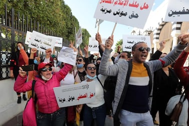 Tunisian journalists shout slogans during a demonstration organised by The National Syndicate of Tunisian Journalists (SNJT) next to the government palace in Tunis, Tunisia, on 26 November 2020.EPA