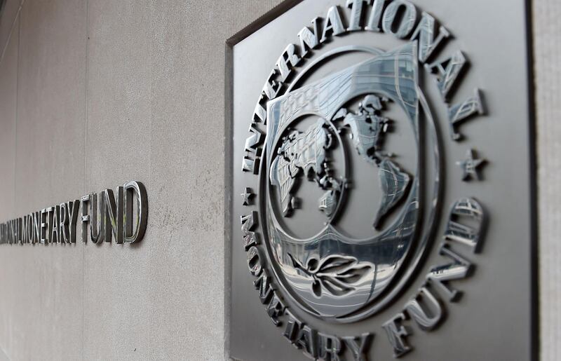 An exterior view of the building of the International Monetary Fund (IMF), with the IMG logo, is seen on March 27, 2020 in Washington, DC.  The coronavirus pandemic has driven the global economy into a downturn that will require massive funding to help developing nations, IMF chief Kristalina Georgieva said on March 27, 2020. / AFP / Olivier DOULIERY
