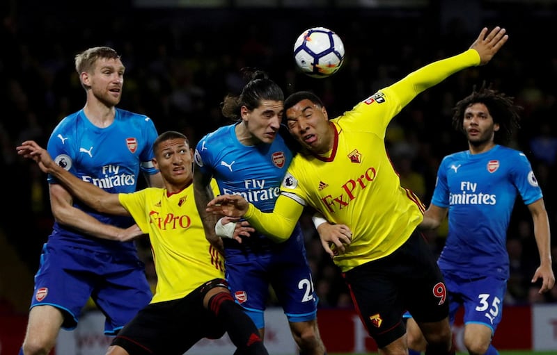 Soccer Football - Premier League - Watford vs Arsenal - Vicarage Road, Watford, Britain - October 14, 2017 - Watford's Troy Deeney and Richarlison in action with Arsenal's Hector Bellerin and Per Mertesacker. Action Images via Reuters/Paul Childs  EDITORIAL USE ONLY. No use with unauthorized audio, video, data, fixture lists, club/league logos or "live" services. Online in-match use limited to 75 images, no video emulation. No use in betting, games or single club/league/player publications. Please contact your account representative for further details.     TPX IMAGES OF THE DAY