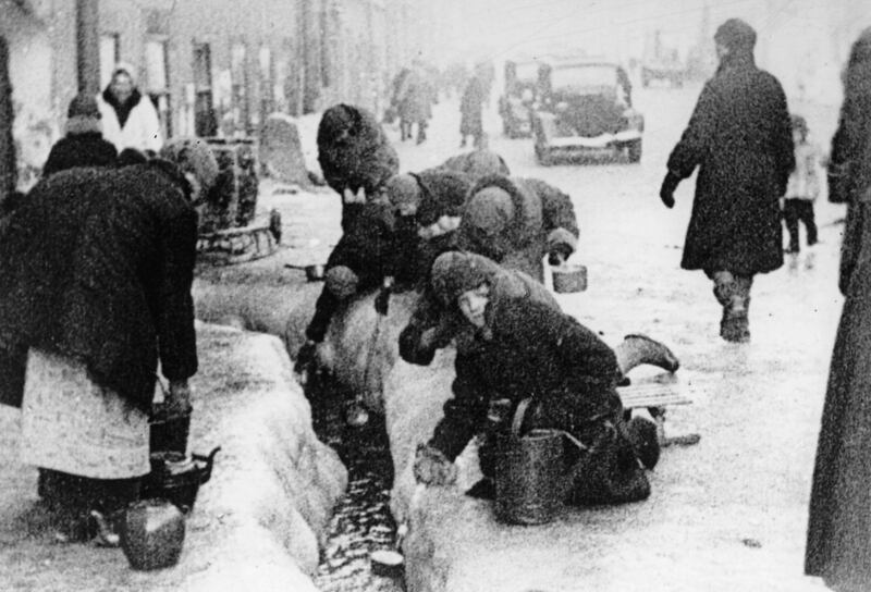 In the winter of 1942, citizens of Leningrad dig up water from a broken main, during the 900-day siege of the Russian city by German invaders. AP