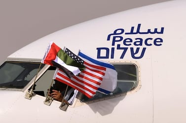 UAE, Israeli and US flags attached to Israel's El Al flight that arrived in Abu Dhabi on August 31. Increased commerce between the UAE and Israel will only serve to strengthen the newly forged diplomatic ties, the UAE Minister of Economy said. AFP