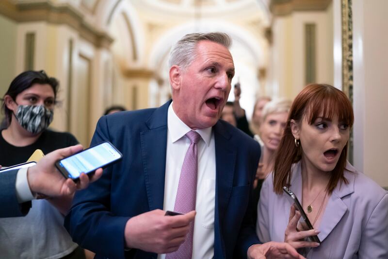 Mr McCarthy heads to his office surrounded by reporters after House investigators issued a subpoena for him and four other Republicans as part of their probe into the violent January 6 insurrection. AP