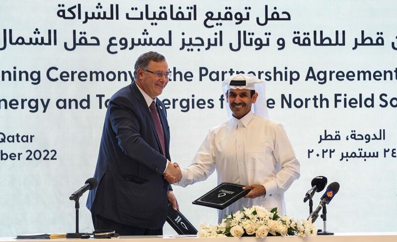 Qatar's Energy Minister Saad Al Kaabi, right, who is also chief executive of Qatar Energy, and TotalEnergies chief executive Patrick Pouyanne at the signing ceremony in Doha on Saturday. AFP