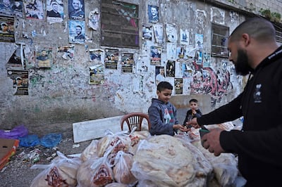 A Palestinian vendor sells bread at the Balata refugee camp, east of Nablus, in the occupied West Bank. AFP