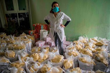 Moroccan volunteers of local organisation National Institute for Solidarity with Women in Distress prepare food donations to be distributed in Casablanca on April 8. Fadel Senna/ AFP 