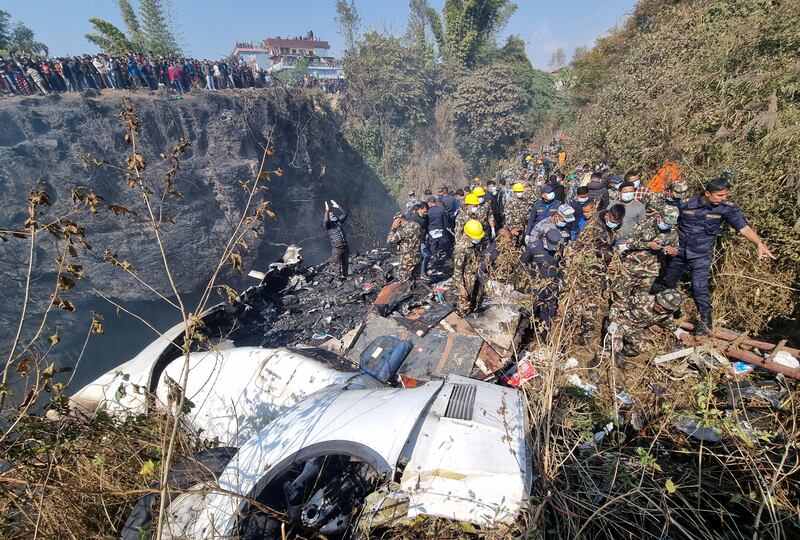 Rescue teams at the crash site. Reuters