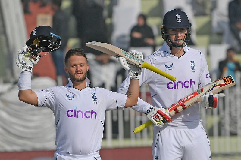 England's Ben Duckett, left, celebrates after scoring a century with teammate Zak Crawley during the first day of the first Test against Pakistan in Rawalpindi on Thursday, December 1, 2022. AFP