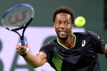 Gael Monfils of France hits a forehand return to Alexander Zverev of Germany during their quarterfinal match at the ATP-WTA Indian Wells tennis tournament on October 13, 2021 in Indian Wells, California.  (Photo by Frederic J.  BROWN  /  AFP)