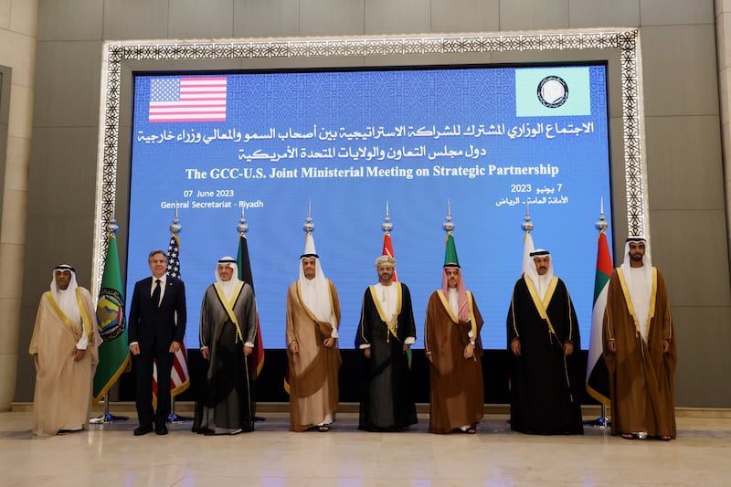 Mr Blinken poses with officials during the meeting in Riyadh. AP