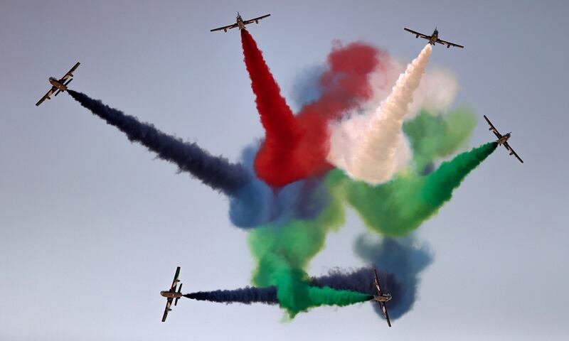 The UAE's Al Fursan aerobatics team perform a fly-over above Dubai World Central in 2021. Photo: EPA