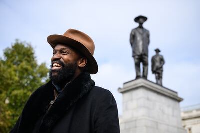 Artist Samson Kambalu speaks to the media after the unveiling of the latest artwork to be displayed on the Fourth Plinth. Getty.