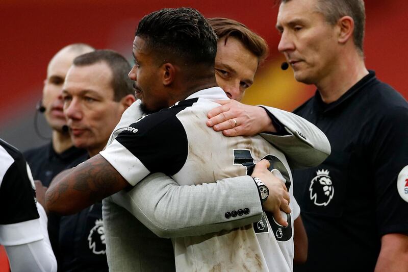 Fulham  manager Scott Parker hugs goalscoring hero Mario Lemina after the match. AFP