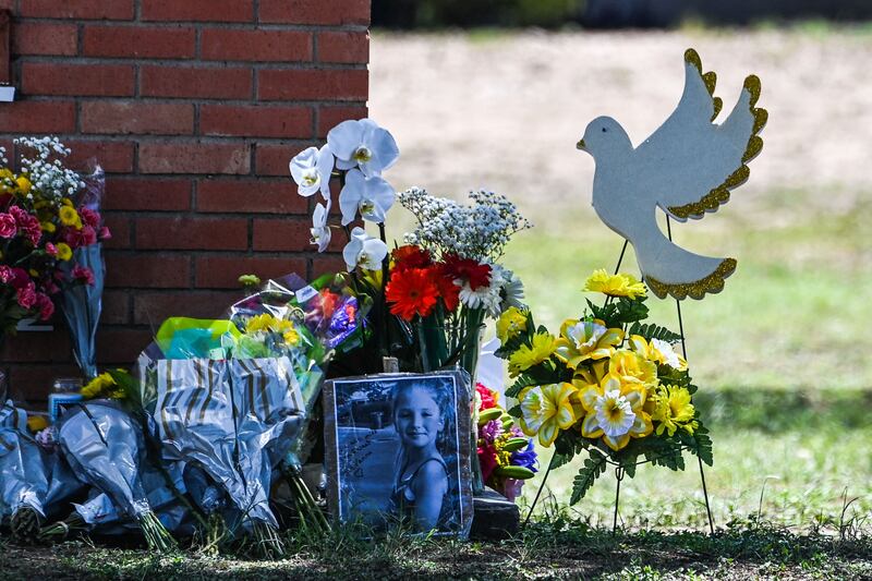 A makeshift memorial in front of Robb Elementary School.  AFP