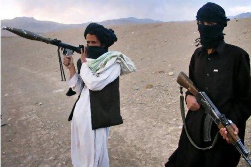 Fighters with Afghanistan's Taliban militia stand on a hillside at Maydan Shahr in Wardak province, west of Kabul. In the ten years since being ousted from power by the US-led invasion, the Taliban have transformed themselves from media-shy mullahs into a technologically-savvy insurgent force who some experts say could end up back in power in the future. AFP PHOTO / STR / FILES