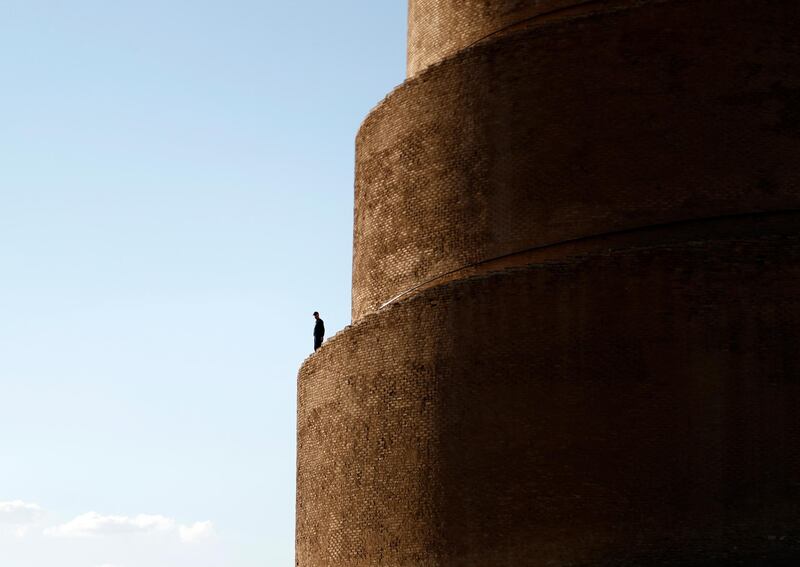 A man stands on the spiral ramp of the 52-metre high Al Malwiya minaret – known as the Snail Shell minaret – at the Al Mutawakkil Mosque, Samarra, Iraq. AP Photo