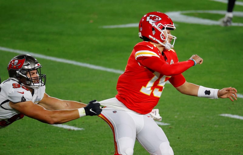 Kansas City Chiefs' Patrick Mahomes in action with Tampa Bay Buccaneers' Anthony Nelson. Reuters