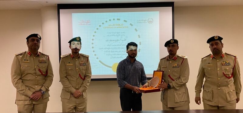 Tariq Mahmood was honoured by police after handing in Dh1 million in cash he found. Photo: Dubai Police