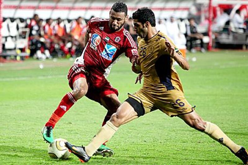 Champions Al Jazira and Dubai Club comepte in a Pro League match last season. The UFL's operating powers have been dissolved and handed to the Football Association.