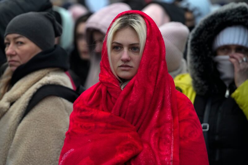 Refugees, mostly women and children, wait for transportation after fleeing Ukraine. AP