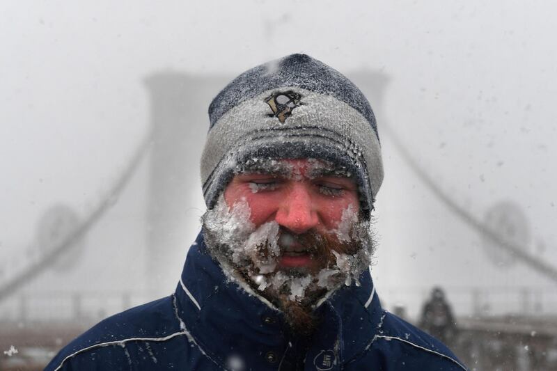 A pedestrian walks across the Brooklyn Bridge. Darren Ornitz / Reuters