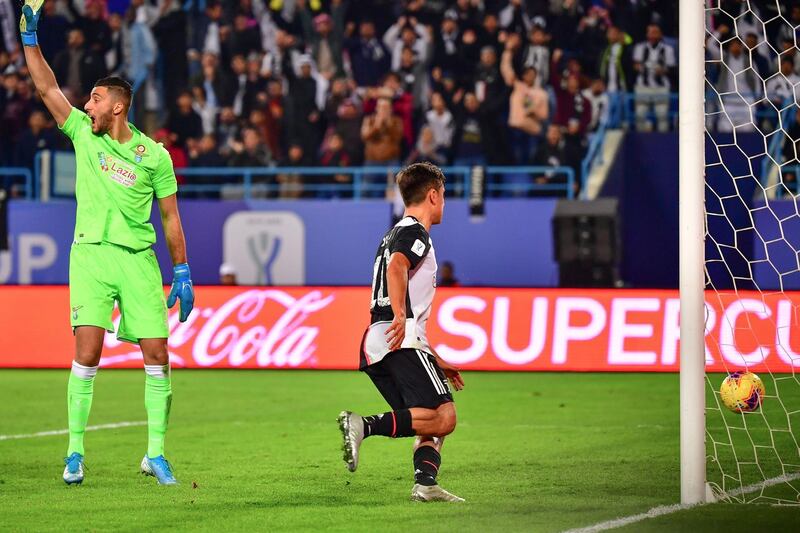 Lazio's Albanian goalkeeper Thomas Strakosha (L) reacts after conceding a goal from Juventus' Argentine forward Paulo Dybala. AFP