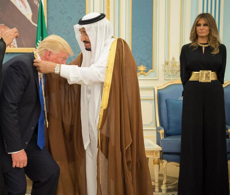 First Lady Melania Trump looks on as her husband, US president Donald Trump receives the Order of Abdulaziz Al Saud medal from Saudi Arabia’s King Salman. Photo by Saudi Press Agency 
