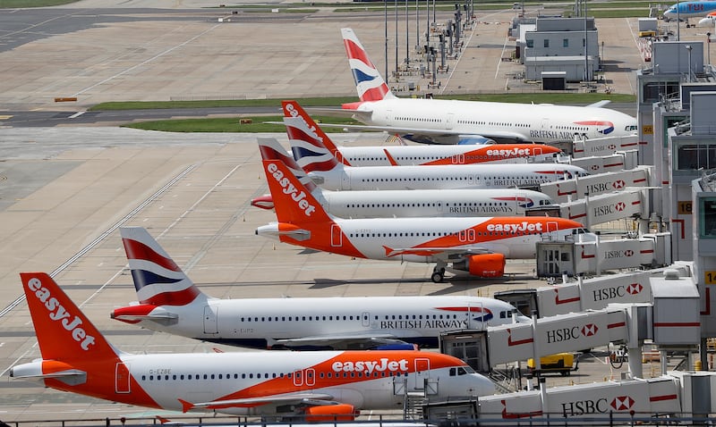 Aircraft are parked at the South Terminal at Gatwick Airport, in England. The airport has launched an investigation after a passenger died disembarking a plane. Reuters