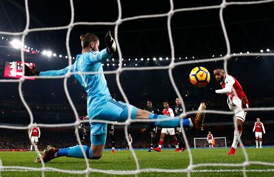 LONDON, ENGLAND - DECEMBER 02:  David De Gea of Manchester United makes a save from Alexandre Lacazette of Arsenal during the Premier League match between Arsenal and Manchester United at Emirates Stadium on December 2, 2017 in London, England.  (Photo by Julian Finney/Getty Images)