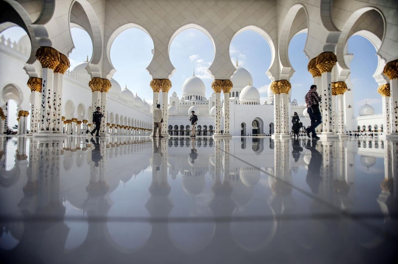 ABU DHABI, UNITED ARAB EMIRATES -JANUARY 22: Sheikh Zayed Grand Mosque is seen in Abu Dhabi, United Arab Emirates on January 22, 2015. Abu Dhabi's iconic landmark is the Sheikh Zayed Grand Mosque, which features eighty-two white domes. Built between 1996 and 2007, it was designed to be an architectural wonder that incorporated both modern and classic Islamic artistic styles. Greek and Italian white marble covers the exterior, while Islamic calligraphy decorates the inside. It is named after the founder and first President of the UAE, the late Sheikh Zayed bin Sultan Al Nahyan. He chose the location and took substantial influence on the architecture and the design of the mosque. (Photo by Ali Hassan/Anadolu Agency/Getty Images)