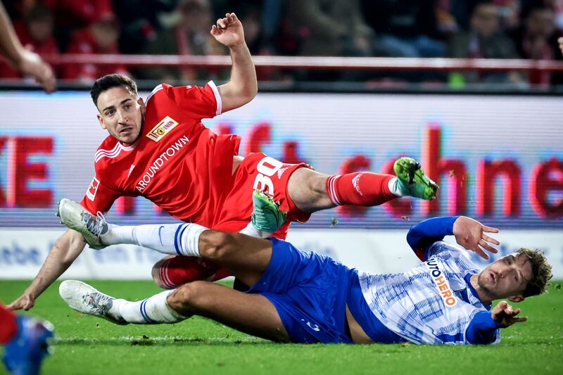 Union's Kevin Moehwald, left, in action against Hertha's Niklas Stark during the Bundesliga meeting in Berlin, Germany, 20 November 2021. EPA