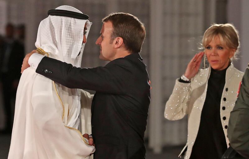 Sheikh Mohammed bin Zayed greets French President Emmanuel Macron. Karim Sahib / AFP Photo
