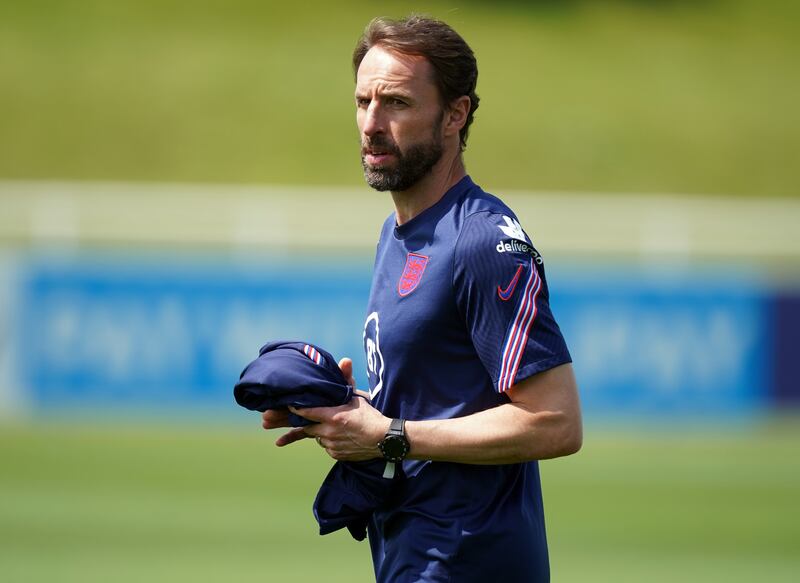 England manager Gareth Southgate oversees the training session.