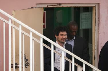 FTX founder Sam Bankman-Fried, left, is escorted from the Magistrate Court in Nassau, Bahamas, Wednesday, Dec.  21, 2022, after agreeing to be extradited to the U. S.  (AP Photo / Rebecca Blackwell)