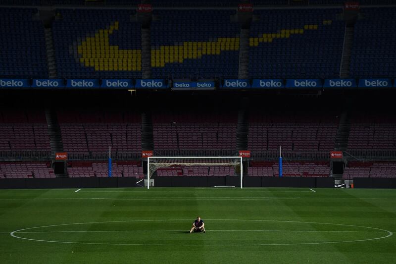 Barcelona's Andres Iniesta sits on the pitch at the match. David Ramos / Getty Images