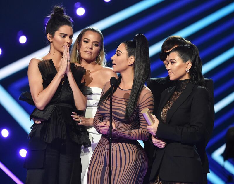 SANTA MONICA, CA - NOVEMBER 11:  2018 E! PEOPLE'S CHOICE AWARDS -- Pictured: (l-r) TV personalities Kendall Jenner, Khloe Kardashian, Kim Kardashian, Kourtney Kardashian, and Kris Jenner accept The Reality Show of 2018 award for "Keeping Up with the Kardashians" on stage during the 2018 E! People's Choice Awards held at the Barker Hangar on November 11, 2018 --  NUP_185094  --  (Photo by Alberto Rodriguez/E! Entertainment/NBCU Photo Bank/NBCUniversal via Getty Images)
