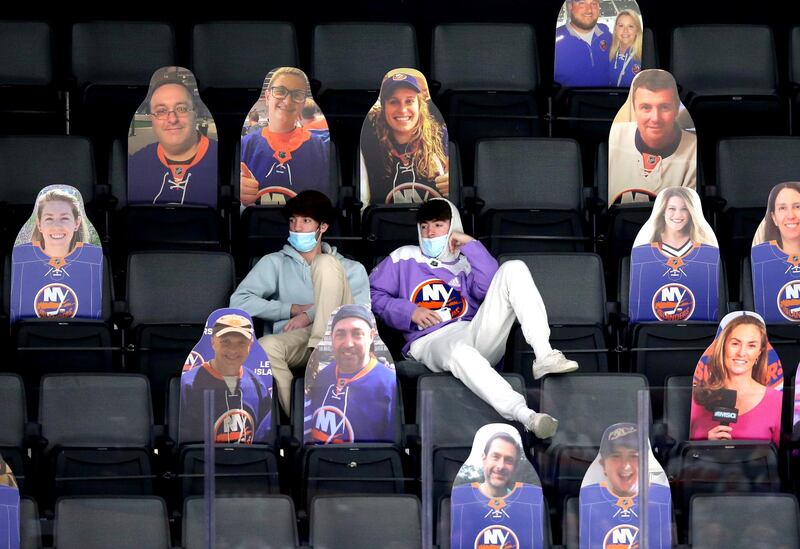 Ice hockey fans sit among cardboard cutouts during the third and final period of the match between the New York Islanders and the Philadelphia Flyers at Nassau Veterans Memorial Coliseum in Uniondale, New York. The Flyers won the match 4-3. USA Today Sports / Reuters