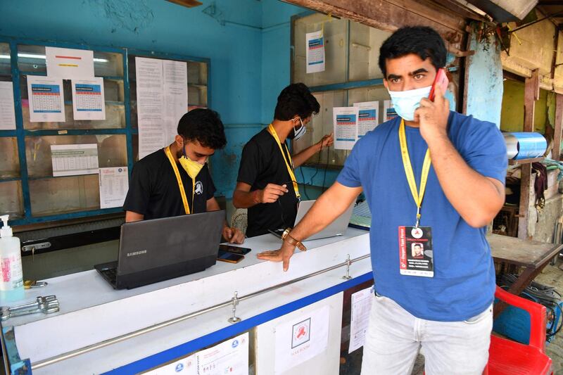 In this photograph taken on April 28, 2021, local resident Shanawaz Shaikh, who sold his SUV to raise funds in order to start a free service to provide oxygen cylinders to needy people amid the Covid-19 coronavirus pandemic, speaks on the phone at an oxygen distribution centre in a slum in Mumbai. As their government struggles to tackle the Covid-19 pandemic, young Indians have stepped into the breach, setting up apps to crowdsource aid, delivering key supplies and using social media to direct resources to people in need. - TO GO WITH health-virus-India-youth-internet-computers,FOCUS by Ammu KANNAMPILLY
 / AFP / INDRANIL MUKHERJEE / TO GO WITH health-virus-India-youth-internet-computers,FOCUS by Ammu KANNAMPILLY
