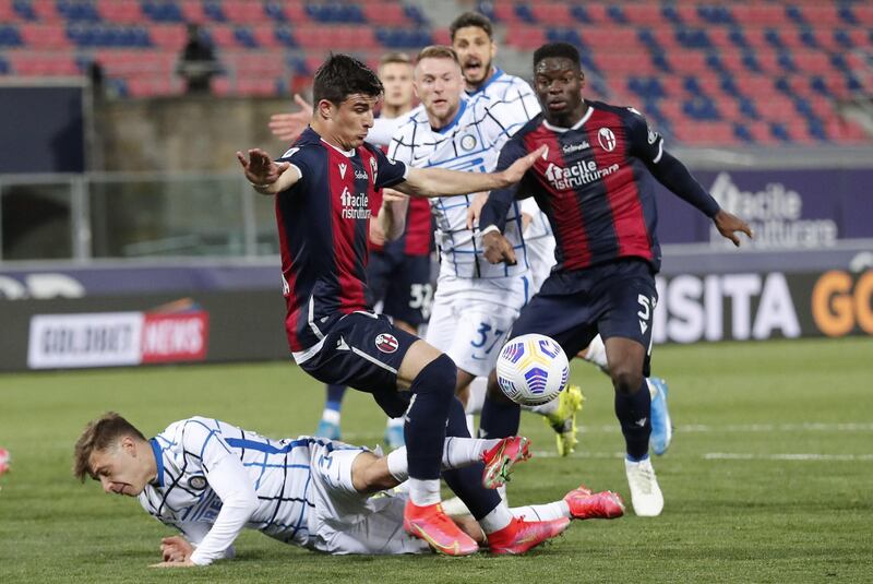 Bologna's Riccardo Orsolini and Inter's Nicolo Barella in action. EPA