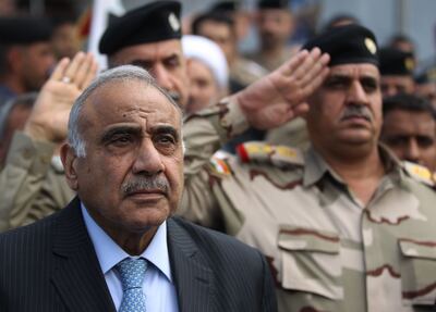 (FILES) In this file photo taken on October 23, 2019, Iraq's Prime Minister Adel Abdel Mahdi attends a symbolic funeral ceremony in Baghdad for a commander of the Iraqi Federal Police's Fourth Division, who was killed in Samarra, north of the Iraqi capital. As anti-government protests sweep his country since the begining of October 2019, Iraq's embattled premier has found his decision-making powers clipped by rivals and his entourage subject to increasing pressure from Iran, Iraqi officials told AFP. Adel Abdel Mahdi, 77, came to power last year as the product of a tenuous alliance between populist cleric Moqtada Sadr and pro-Iran paramilitary chief Hadi al-Ameri, with the required blessing of the country's top Shiite religious authority. / AFP / AHMAD AL-RUBAYE
