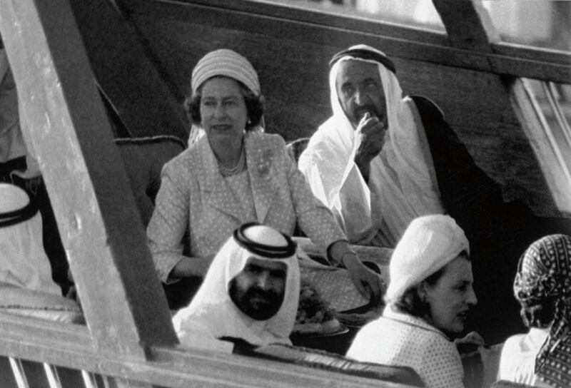 Britain's Queen Elizabeth II sits beside Sheikh Rashid Bun Saeed Al Maktoum, the ruler of Dubai, right, on the Sheikh's  new dhow, as they are taken on a sightseeing tour of Dubai, on Feb. 26, 1979. (AP Photo/Kemp)