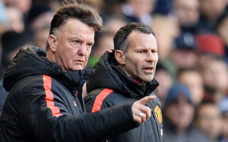 Manchester United manager Louis Van Gaal, with assistant Ryan Giggs, watches his side during their Premier League draw with Tottenham Hotspur on Sunday. Andy Rain / EPA / December 28, 2014