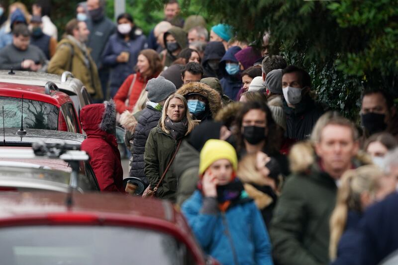 People queue for Covid-19 booster jabs at Sevenoaks in Kent. PA