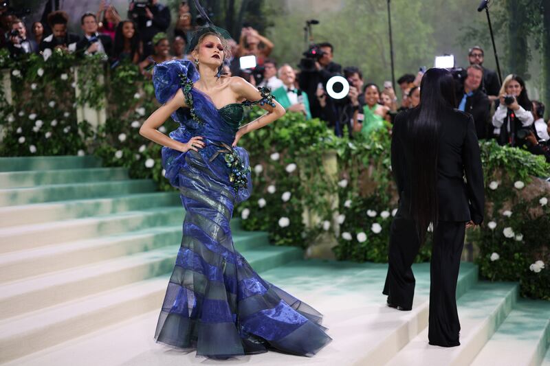 Zendaya, one of this year's co-hosts, walks the 2024 Met Gala red carpet twice. Her first gown is custom John Galliano for Maison Margiela, echoing the high vamp of his Christian Dior years. EPA 
