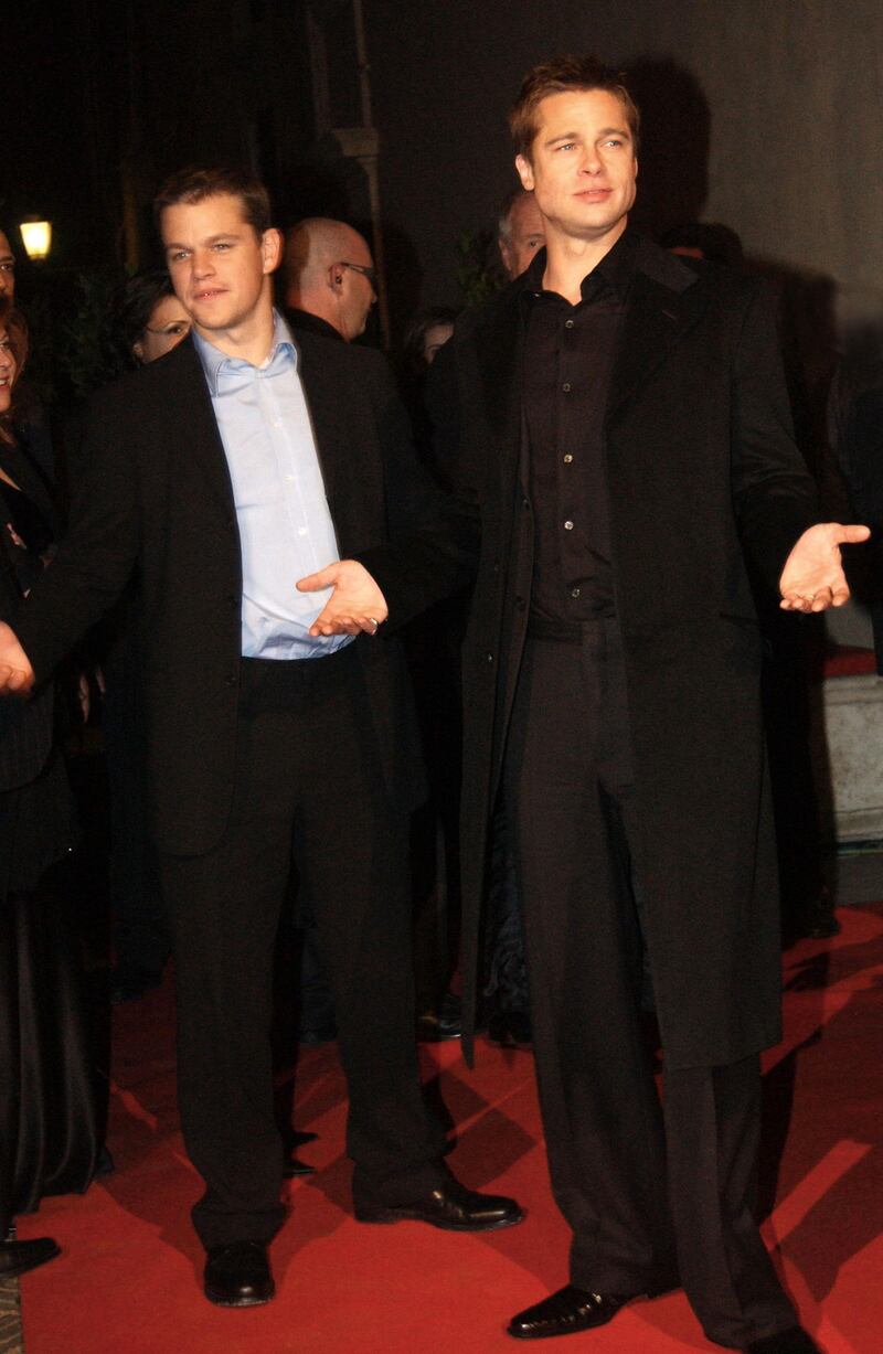 ROME, ITALY - DECEMBER 10:  Actors Matt Damon and Brad Pitt (right) attend the aftershow party following the European premiere of "Ocean's Twelve," the sequel to "Ocean's Eleven," on December 10, 2004 at the Palazzo Venezia in Rome, Italy. (Photo by Franco Origlia/Getty Images)