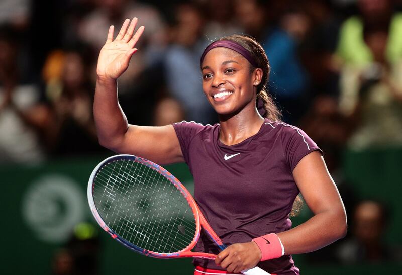 epa07111496 Sloane Stephens of the USA celebrates after defeating Naomi Osaka of Japan in their singles round robin match of the BNP Paribas WTA Finals 2018 at the Indoor Stadium in Singapore, 22 October 2018.  EPA/WALLACE WOON