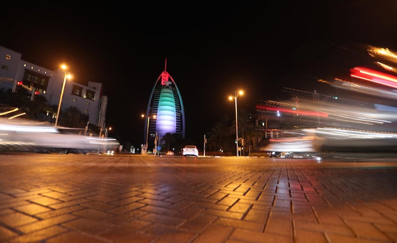 The Burj Al Arab luxury hotel is illuminated in the colors of the UAE flag as a performance to celebrate the UAE's 49th National Day in Dubai United Arab Emirates.  EPA