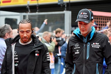 FILE PHOTO: Formula One F1 - Belgian Grand Prix - Spa-Francorchamps, Stavelot, Belgium - September 1, 2019  Mercedes' Lewis Hamilton and Williams' George Russell before the race  REUTERS / Johanna Geron / File Photo
