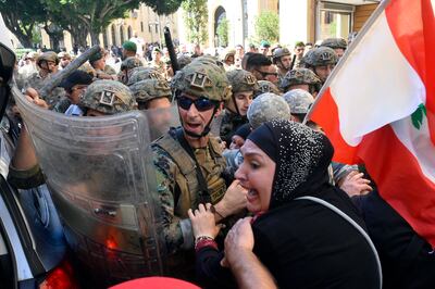 Lebanese soldiers face off with protesters outside of the Lebanese parliament in 2022. EPA